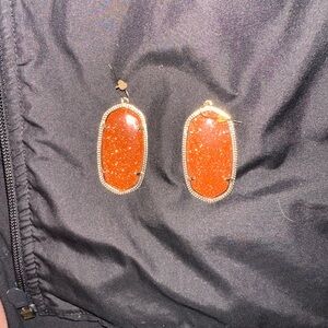 Sparkly red/orange with gold metal